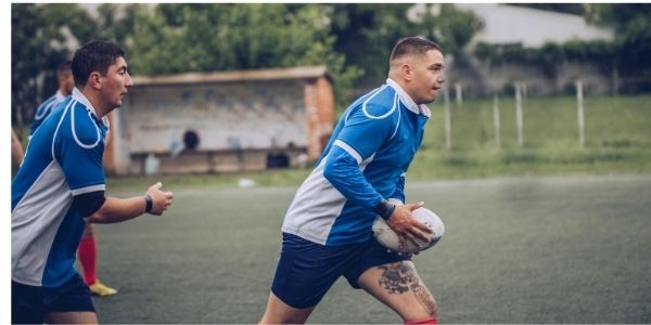 touch rugby player running with the ball