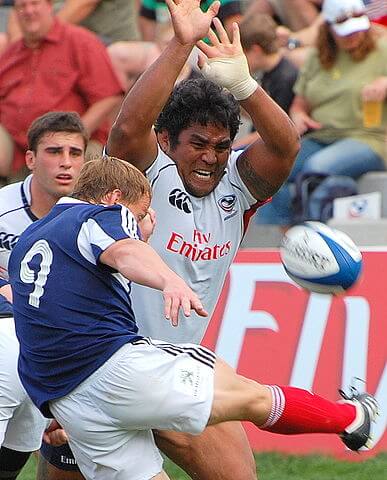 opponent attempts to charge down a box kick by the scrum half