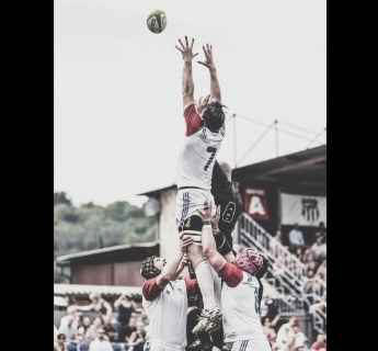 player lifted high in a lineout to catch a ball