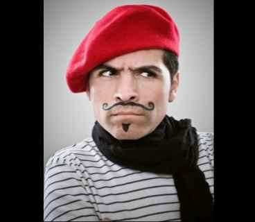 man in red beret looking quizzical