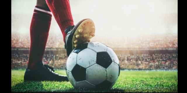 player's foot on soccer ball
