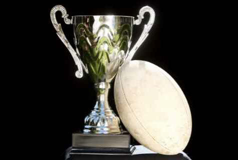 trophy beside a rugby ball